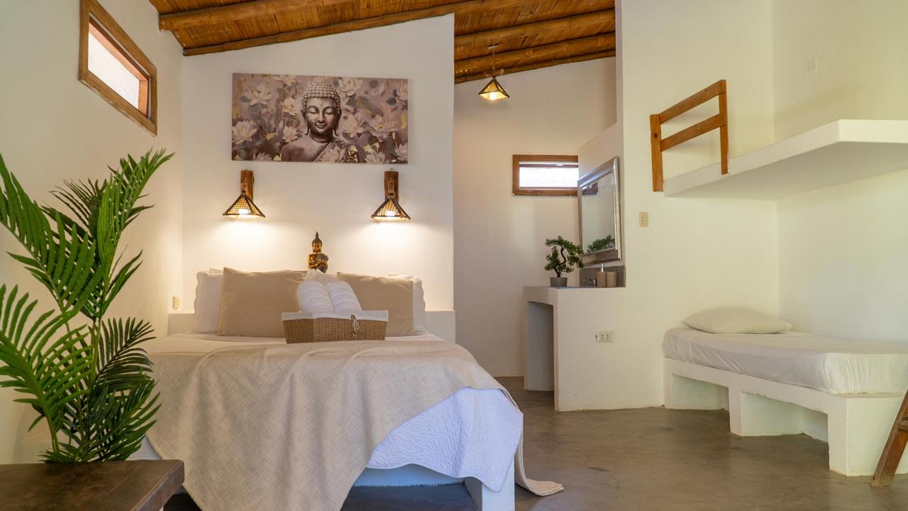 Lombok Suite at Bali Lodge Hotel — sleeps 4 family room with built-in beds, bamboo ceiling, and artisan details