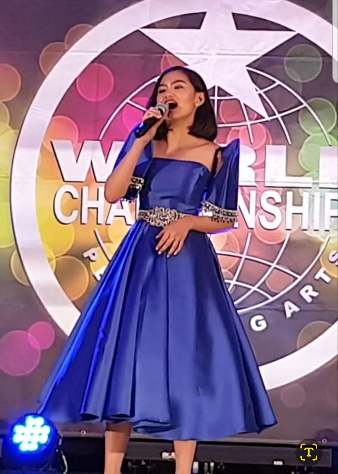 Kendra performing at the World Championship of Performing Arts (WCOPA) 2019 in the USA in blue gown
