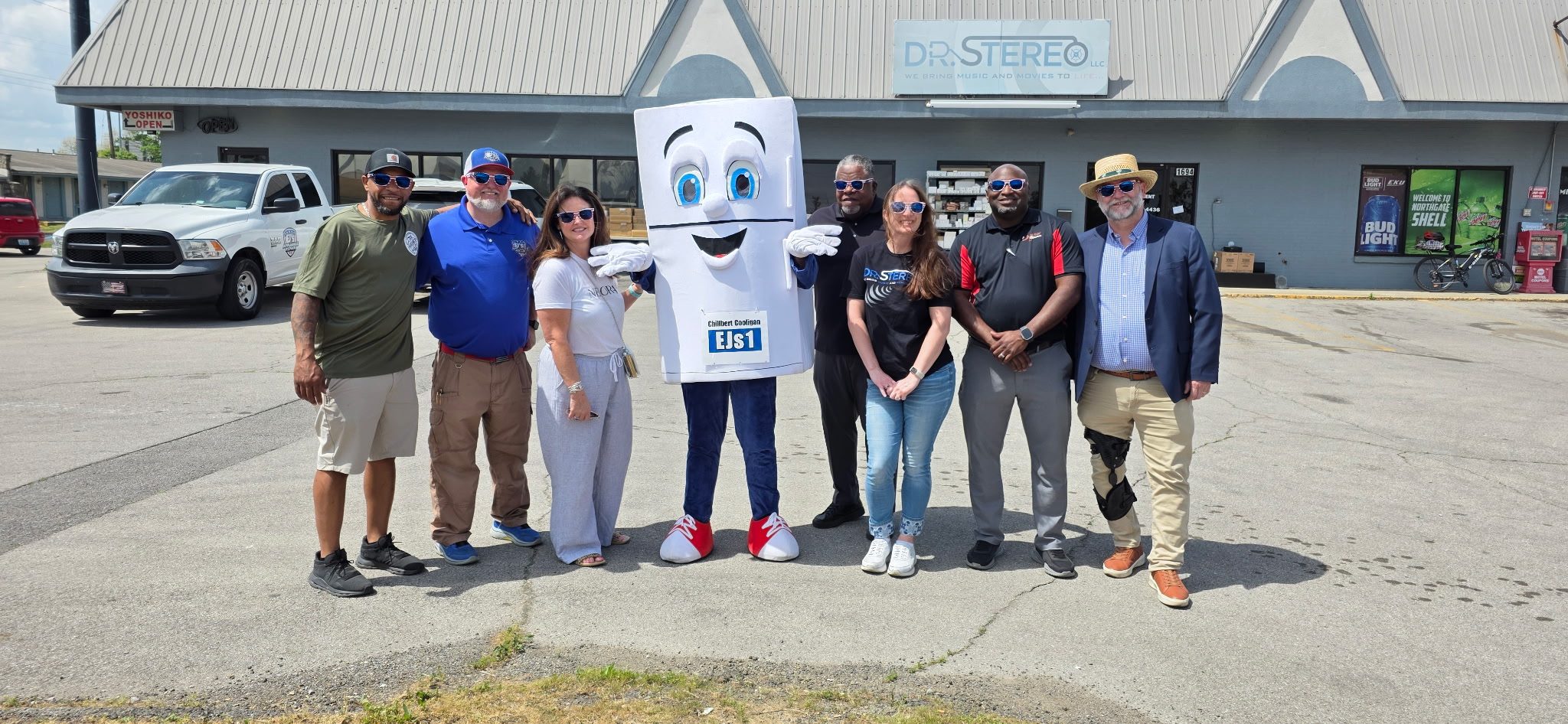 Chillbert Cooligan, EJ, and local business partners outside Dr. Stereo