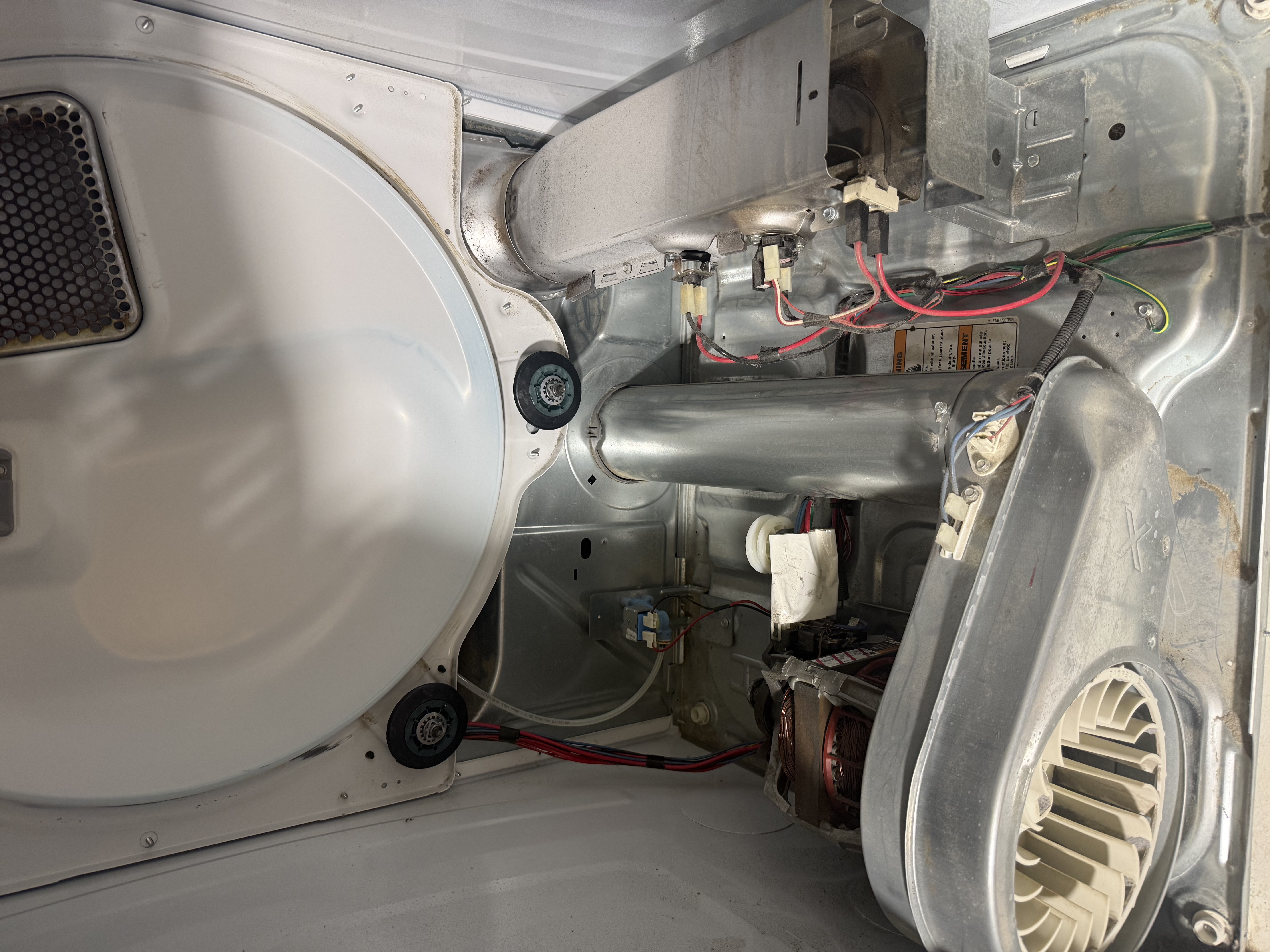 Dryer interior after deep cleaning showing restored chassis, clean blower fan, and free airflow