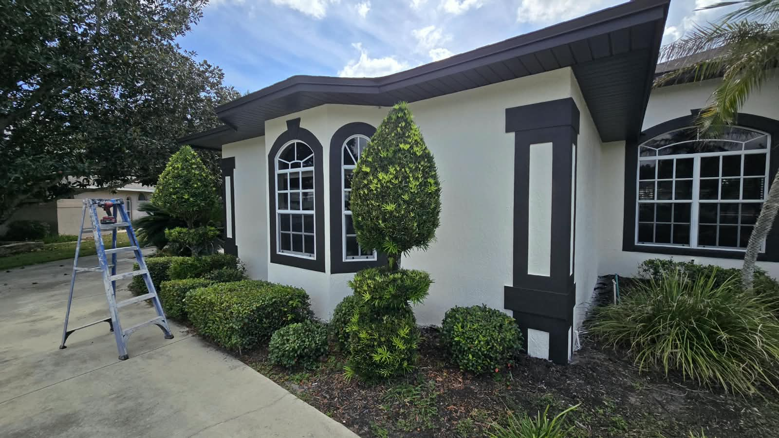Finished bay window and corner pop-out trim work on exterior stucco repaint