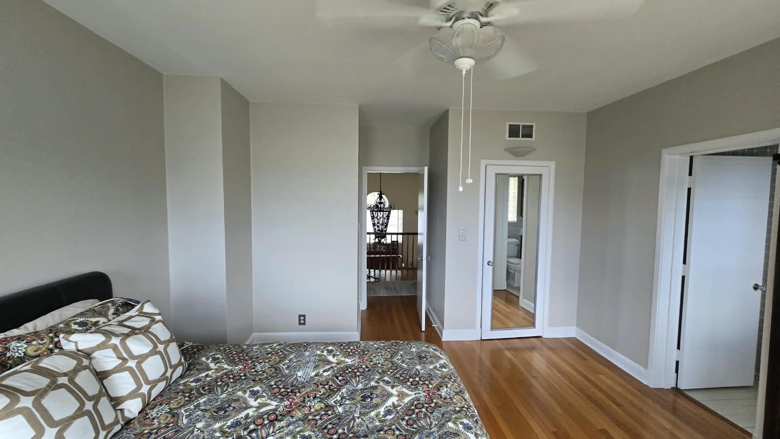 Finished bedroom suite showing even wall coverage and sharp door and trim cut-ins