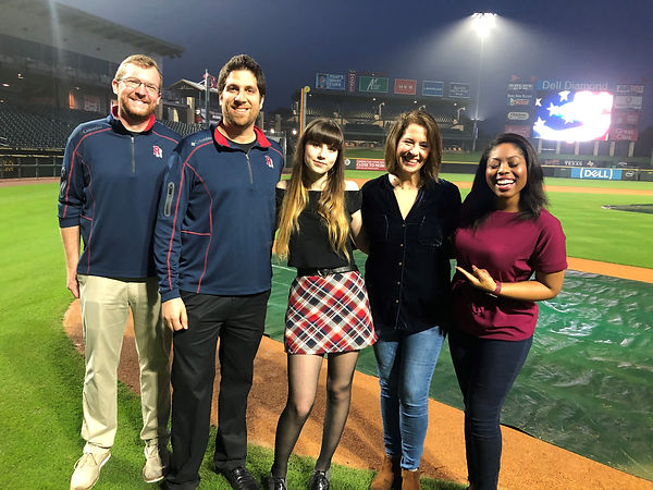 Laurie Winckel with Round Rock Express staff and singers on the Dell Diamond baseball field