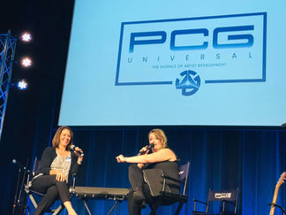 Laurie Winckel on stage interview with Jennifer McGill, former Disney Mouseketeer at PCG Universal