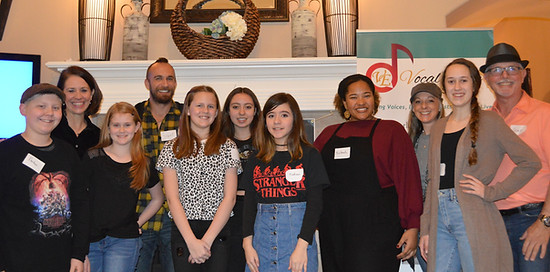 Laurie Winckel with vocal students and coaches gathered at a Vocal Edge vocal intensive workshop