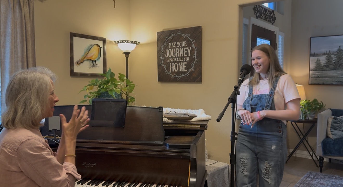 Laurie Winckel coaching student at piano in vocal studio