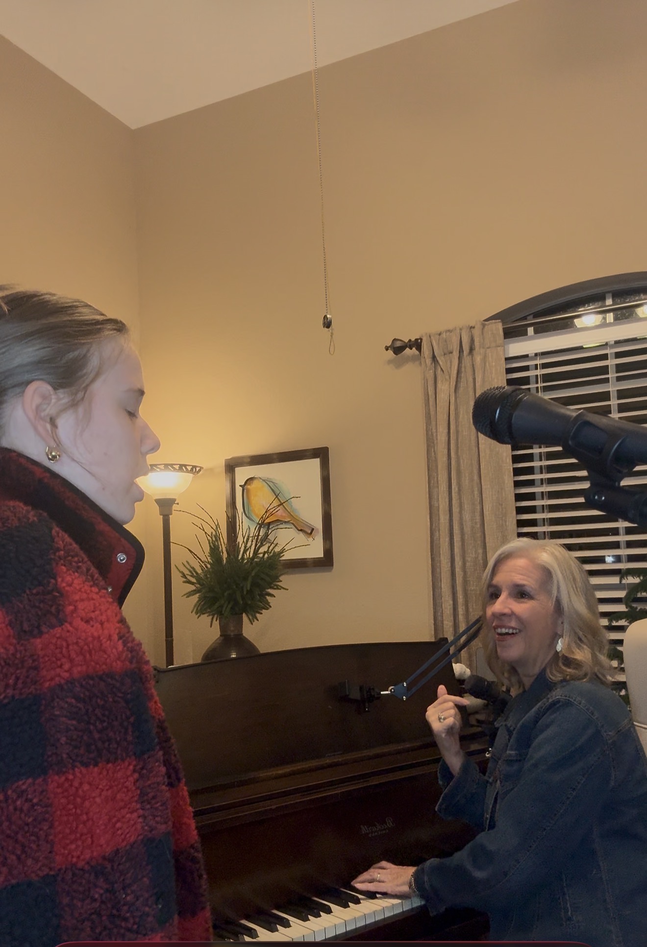 Laurie Winckel coaching a vocal student at the piano during a vocal technique assessment