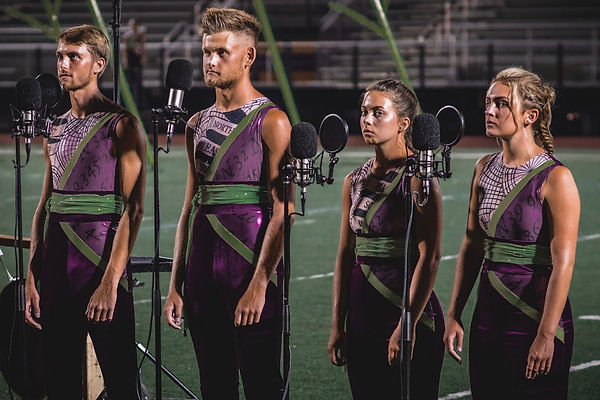 Boston Crusaders Drum and Bugle Corps vocalists performing on the field during their DCI summer tour