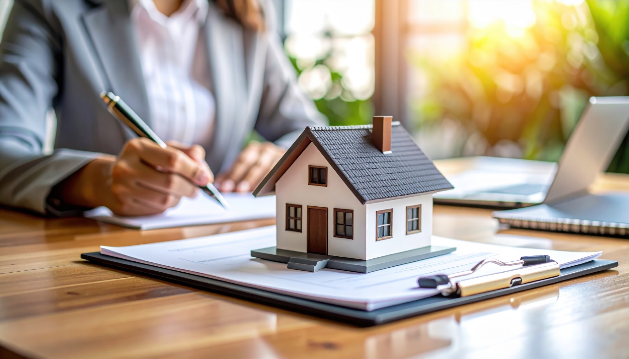 Real estate transaction paperwork and model home