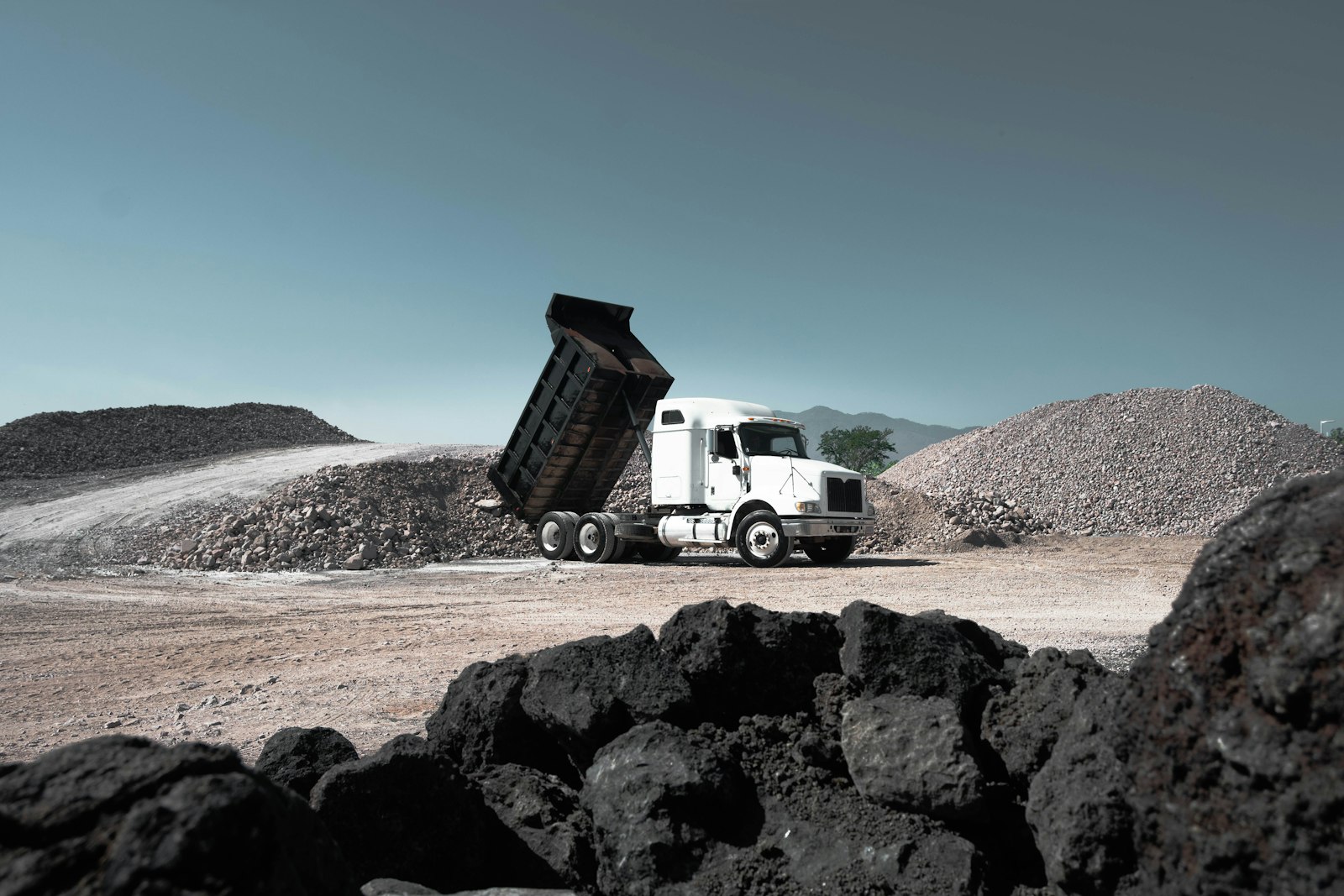 Dump truck hauling aggregate at a commercial quarry