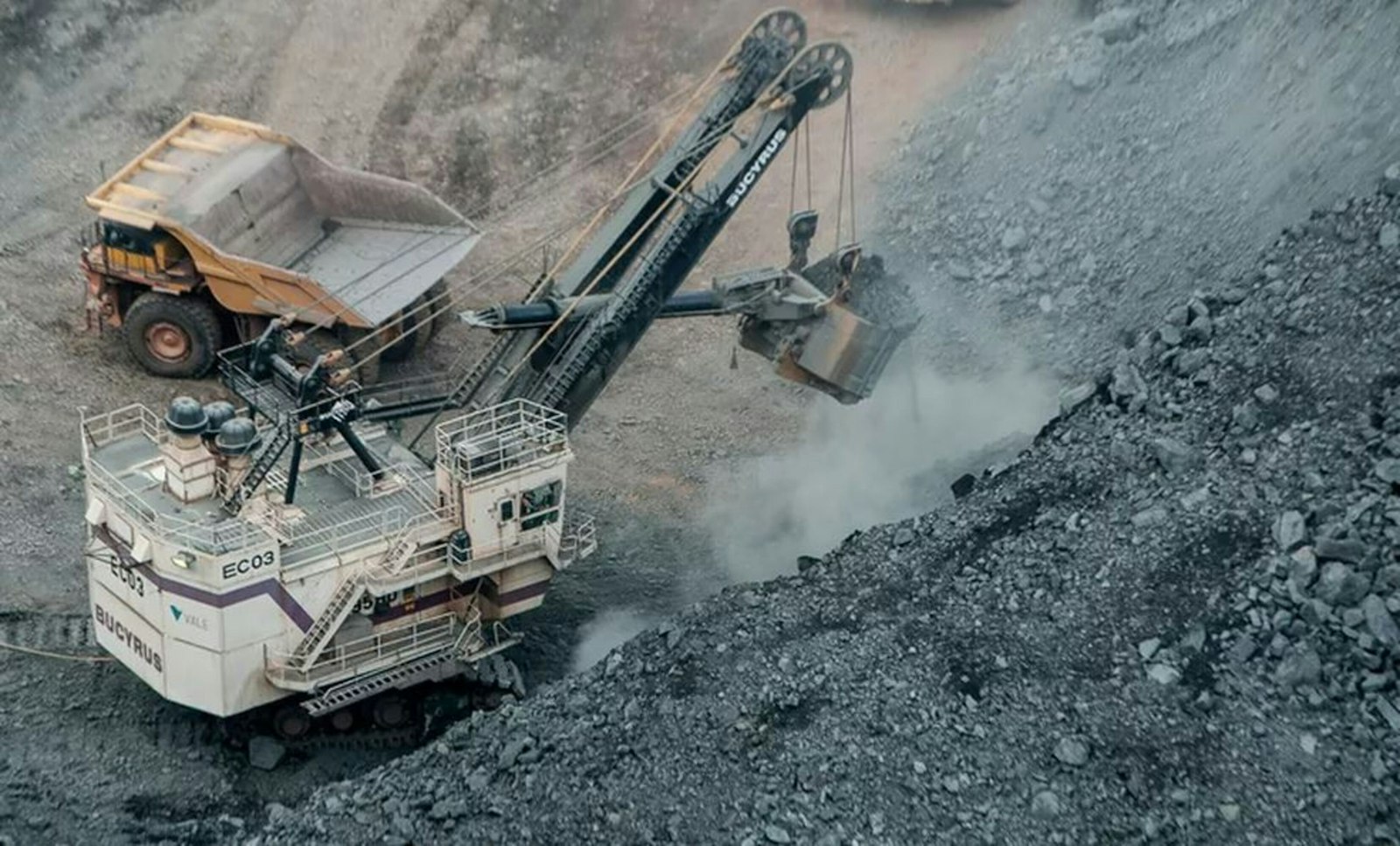 Dump truck unloading gravel at a construction infrastructure site