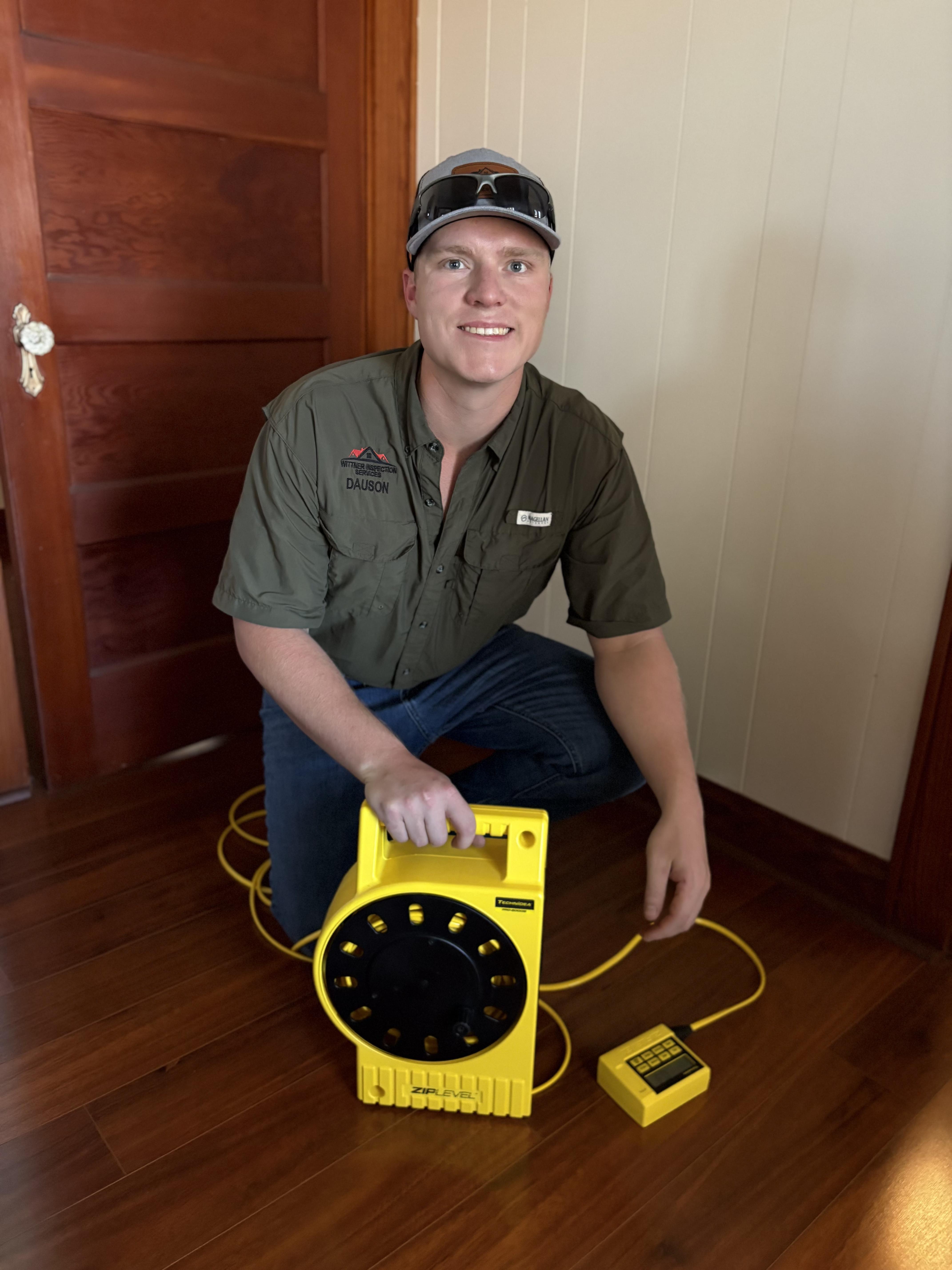 Dauson Wittner conducting home inspection using precision ZIPLEVEL equipment