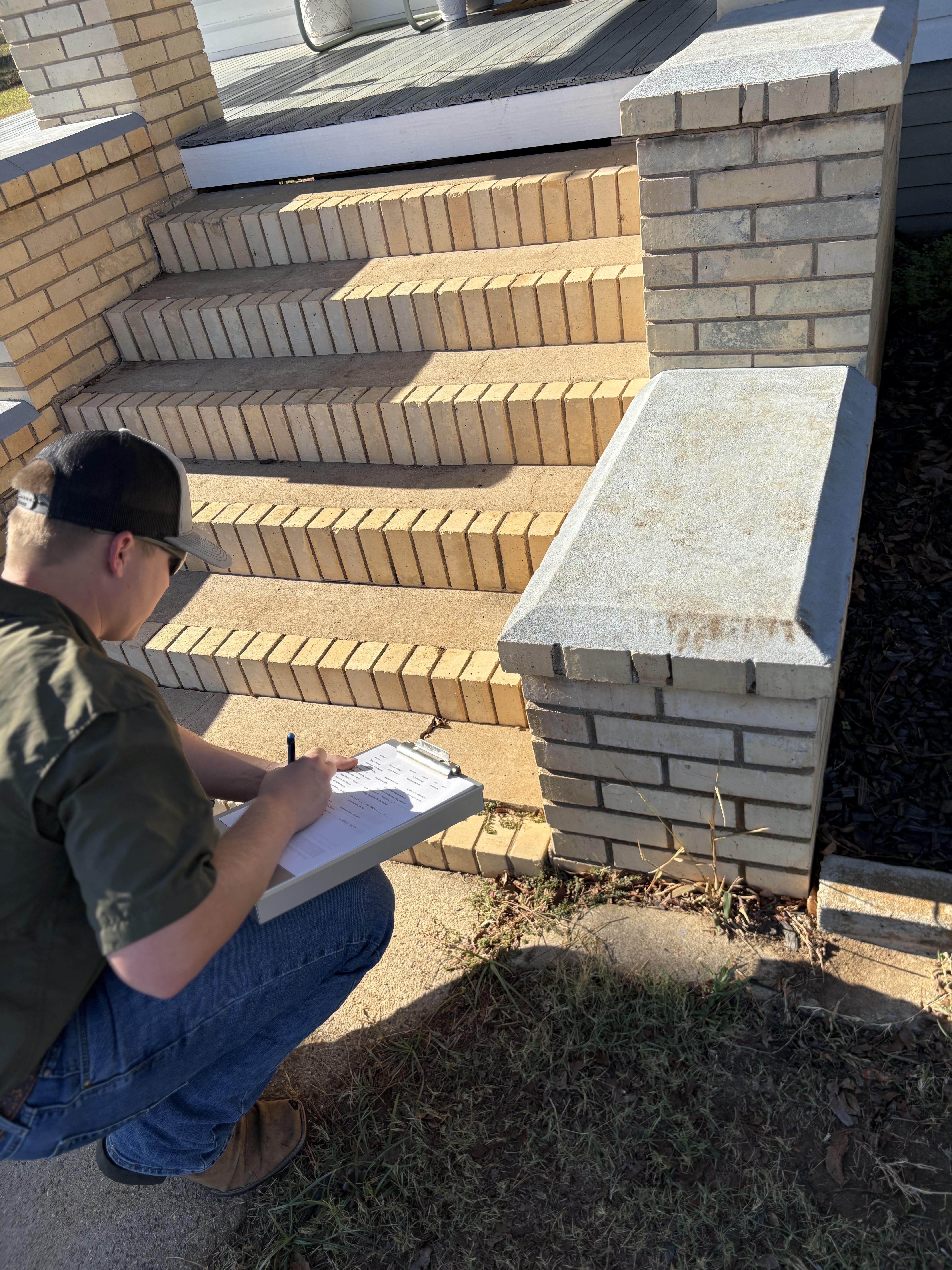 Dauson Wittner completing home inspection paperwork on site