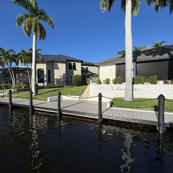 Slate gray vinyl dock with black fascia and rope railings
