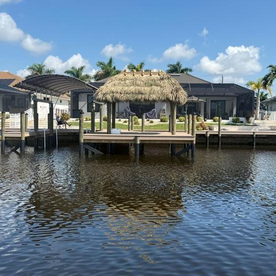 Covered boat lift with protective canopy in Cape Coral