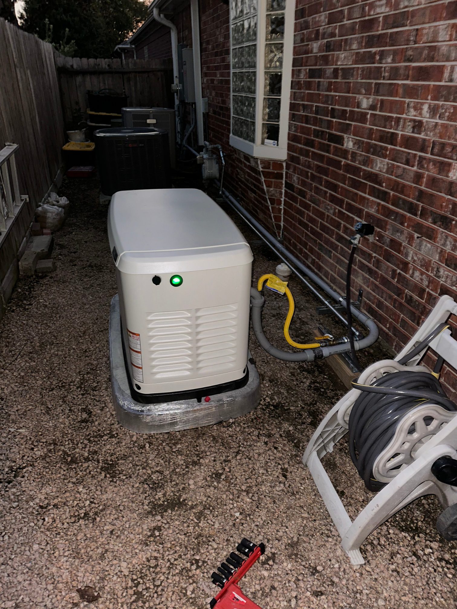 Standby generator installed next to a home