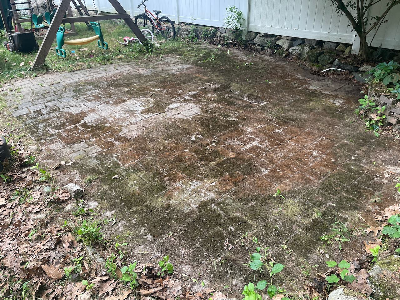 Paver patio — moss and grime washed clean — before