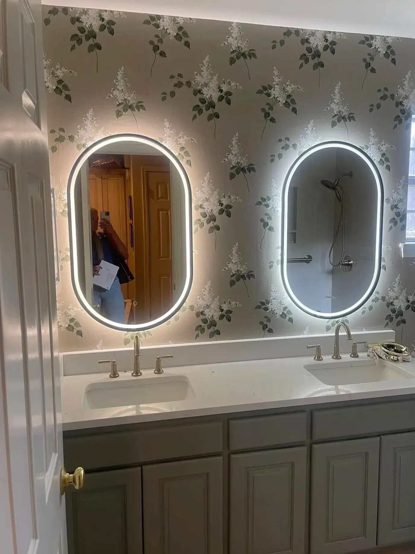 Master bath vanity remodel with dual backlit LED mirrors, quartz countertop, and custom cabinetry
