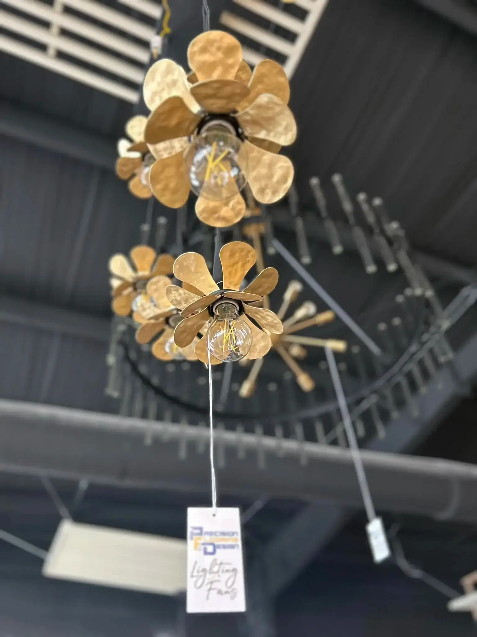 Designer lighting and artisan chandelier selection at Precision Flooring & Design Stillwater showroom