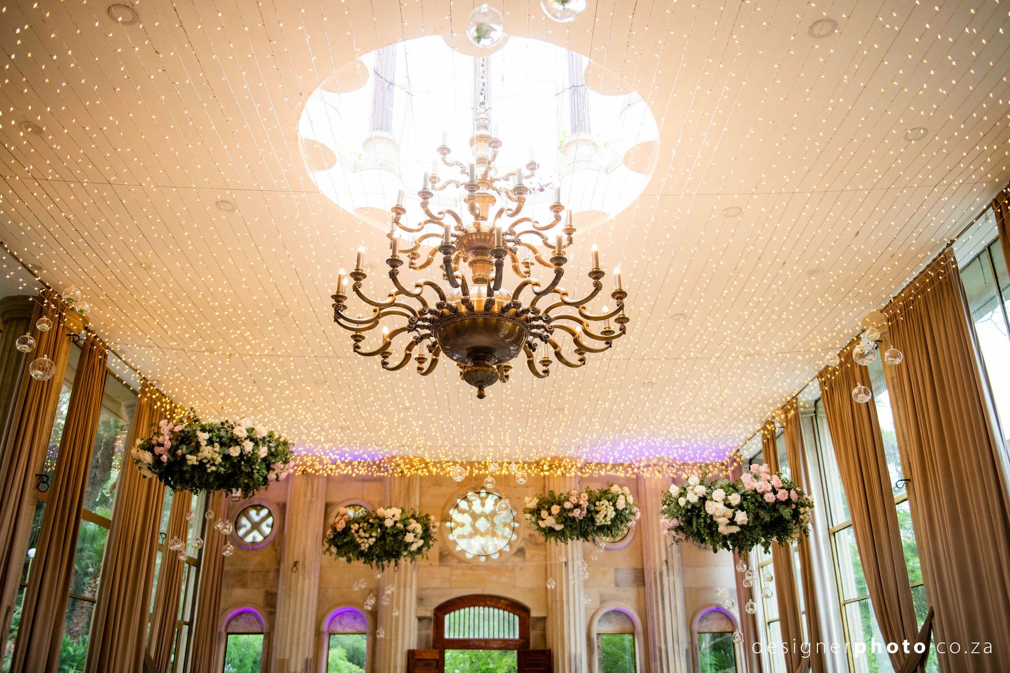 Elegant wedding table setting with emerald and gold accents