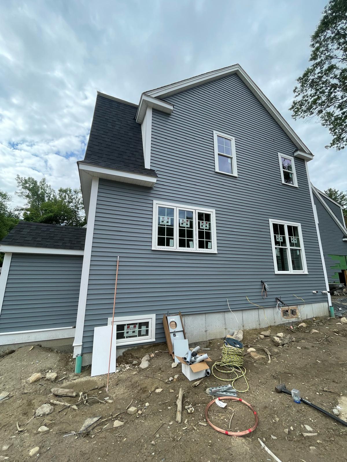 New construction home exterior electrical meter rough-in and copper ground rod installation by Prime Light Electric LLC in Auburn MA