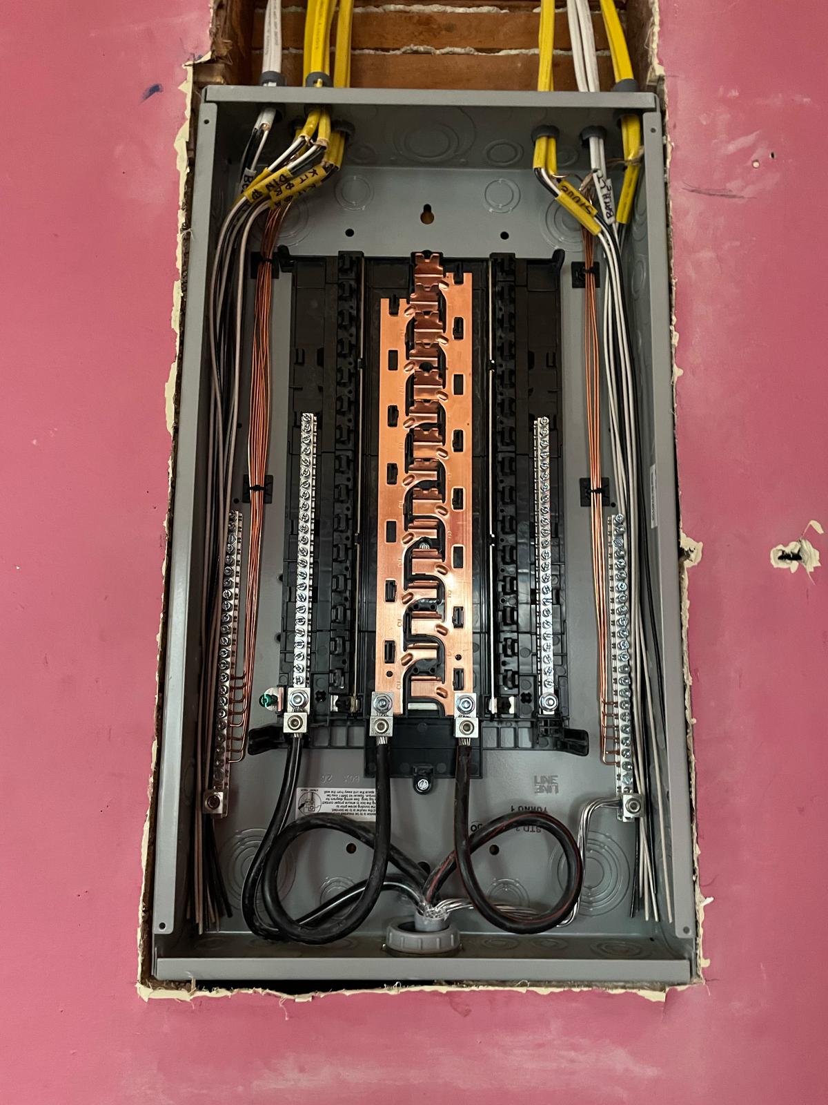 Precision copper busbar and labeled branch circuit wiring inside new panel by Prime Light Electric LLC in Shrewsbury MA
