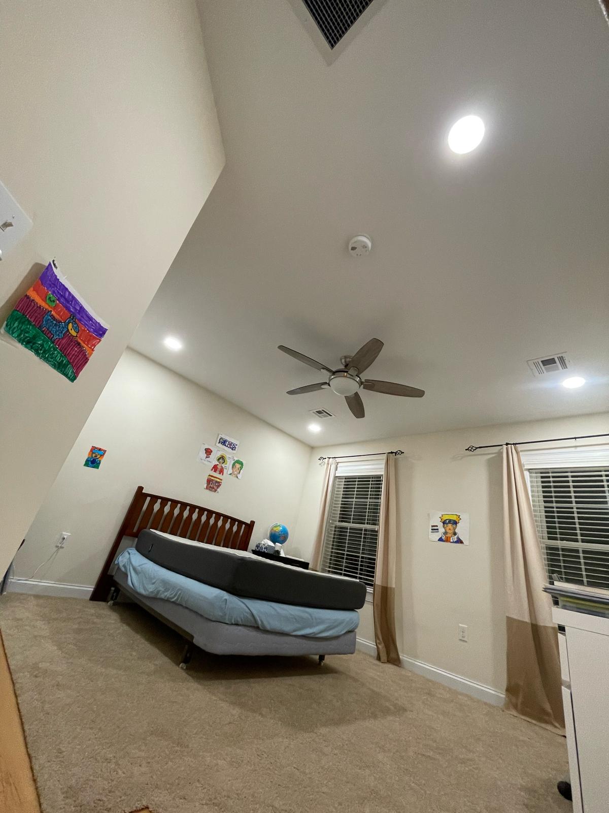 Vaulted ceiling bedroom ceiling fan, hardwired smoke detector, and recessed LED pot lights installed by Prime Light Electric LLC in Worcester MA