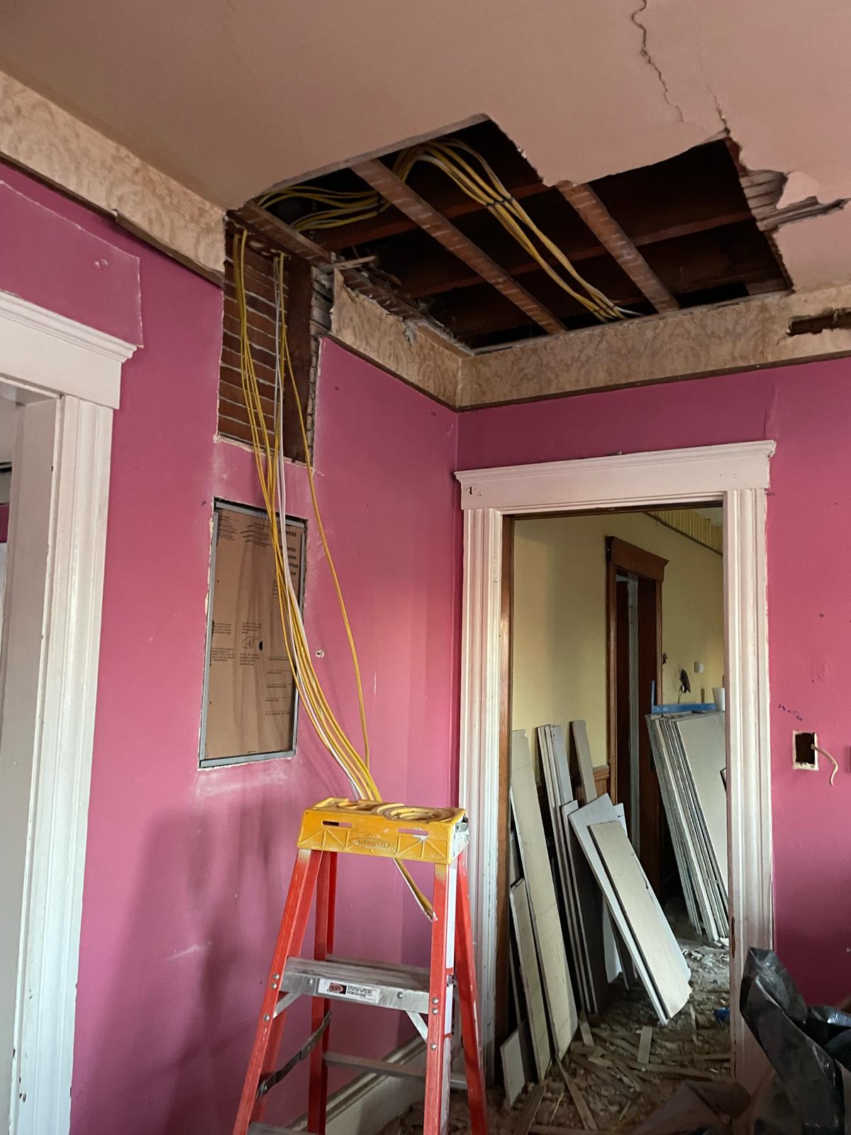 Ceiling rough-in and Romex circuit wiring pulled down into flush panel in historic home by Prime Light Electric LLC in Worcester MA