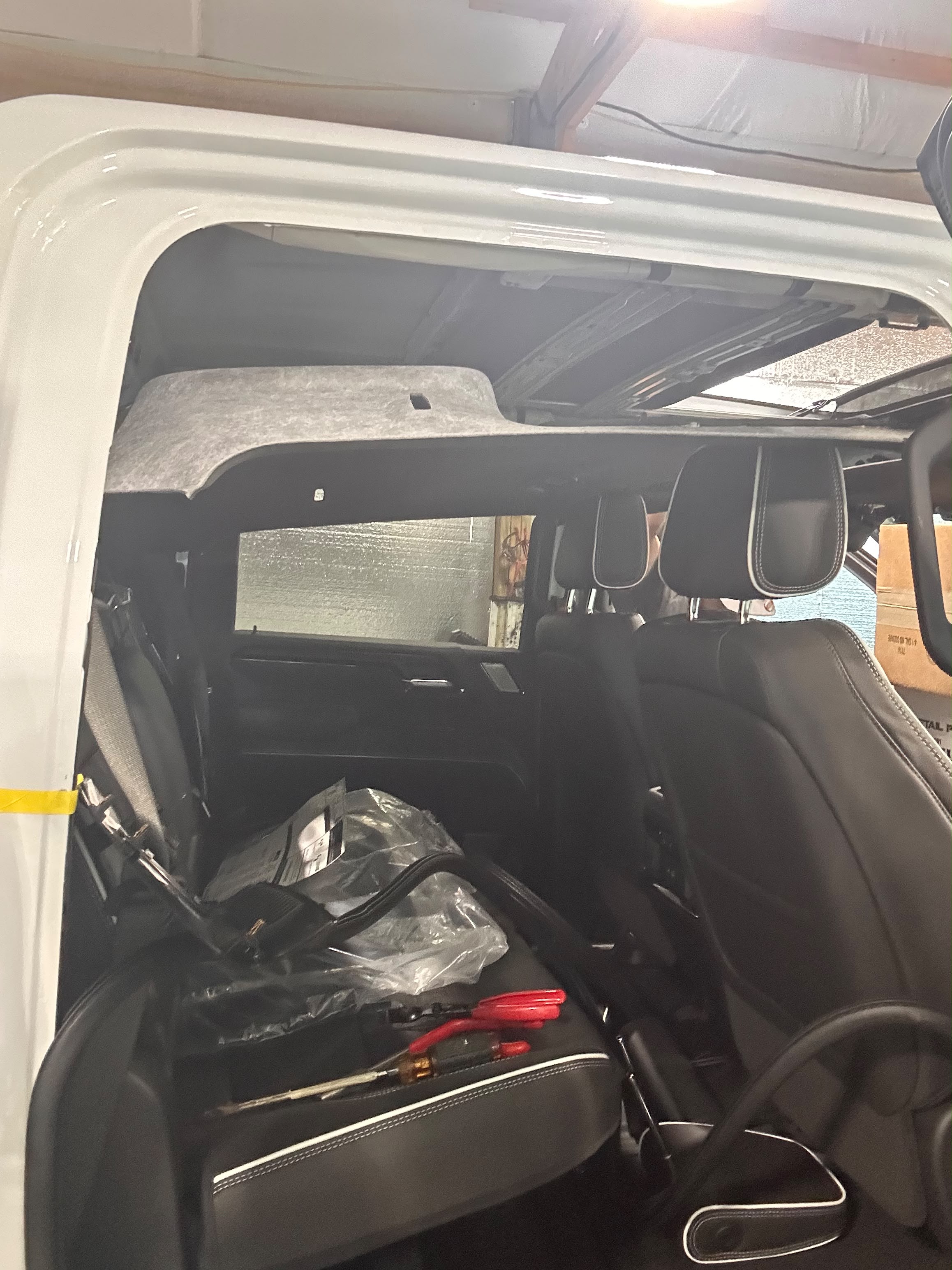 Truck interior cab headliner carefully dropped and masked for roof antenna and exterior wrap prep by Miracle Detailing in Lindon UT