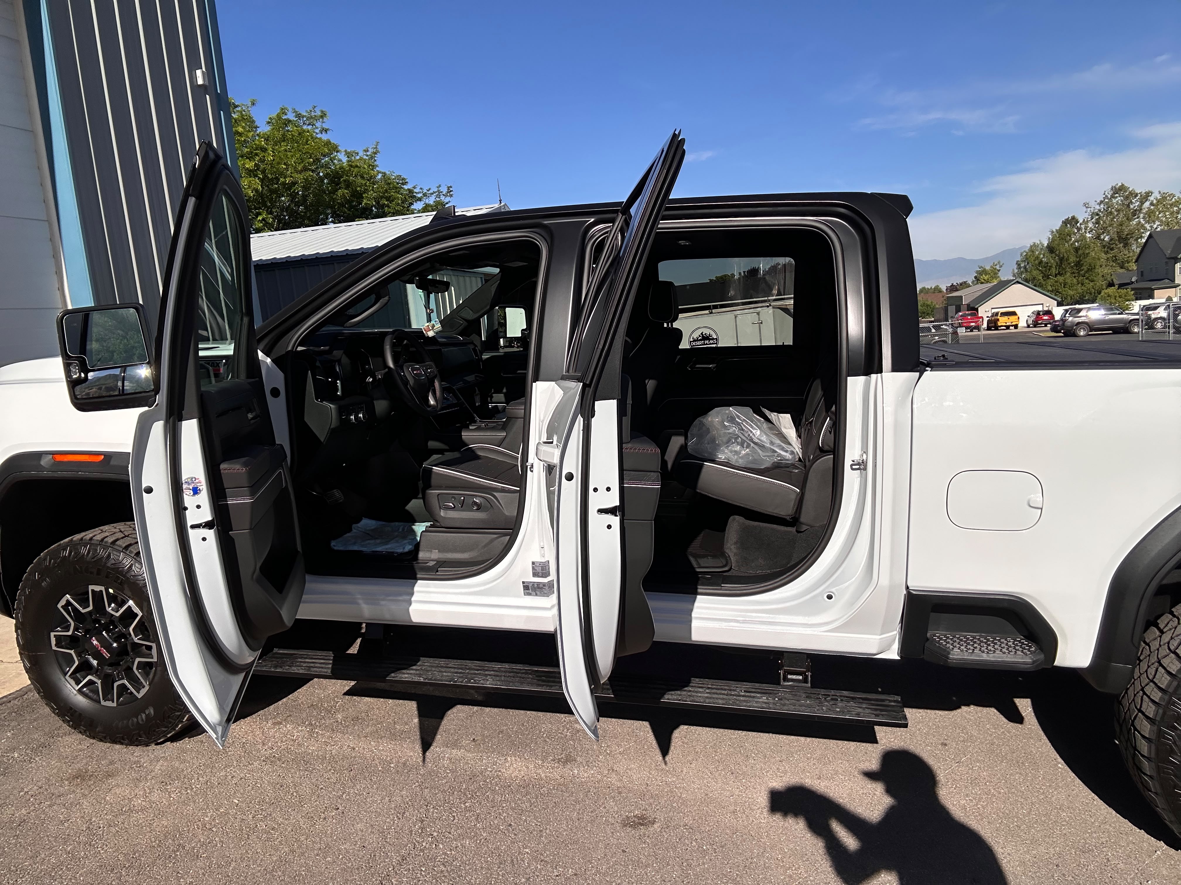 GMC heavy duty truck doors open showing seamless satin black tuxedo roof wrap by Miracle Detailing Lindon UT