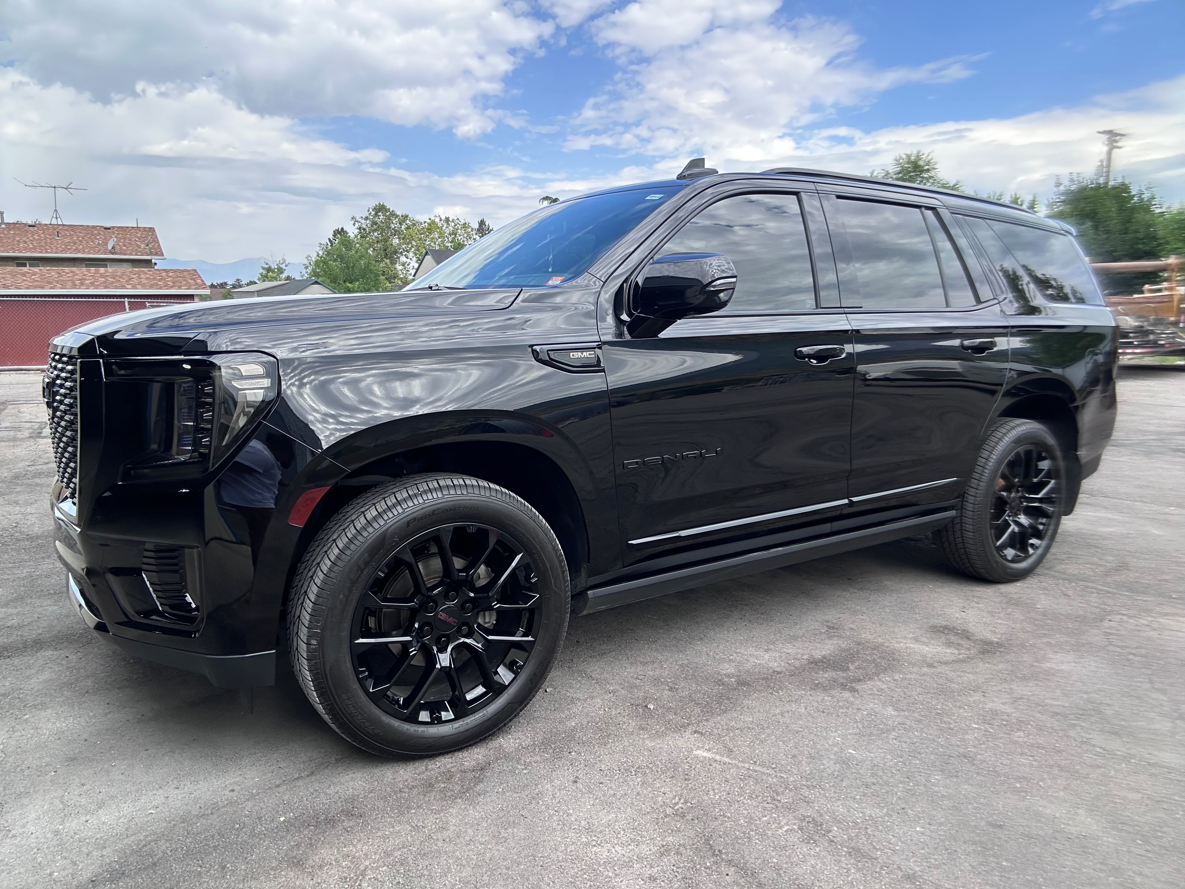 GMC Yukon Denali Black Edition full side profile showroom mirror finish under Utah sky by Miracle Detailing Lindon UT