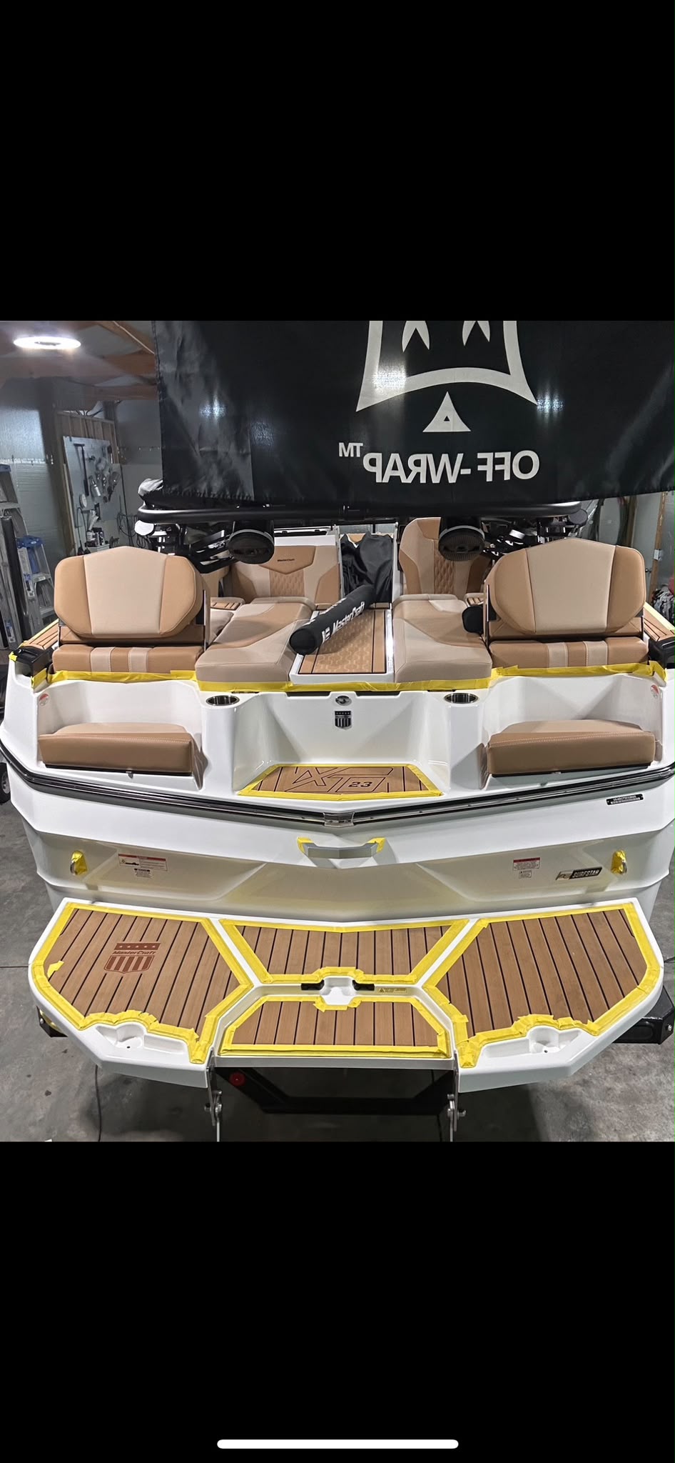 MasterCraft XT23 wakeboard boat stern seating and teak swim platform precision masking prep by Miracle Detailing