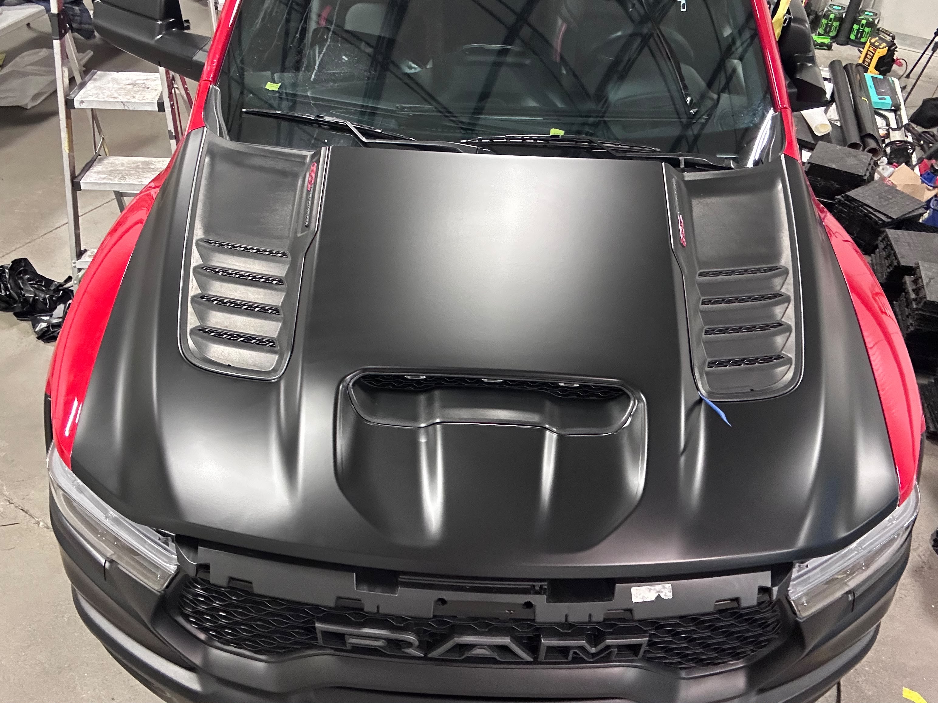 RAM TRX performance truck hood scoop and heat extractors wrapped in satin black vinyl on flame red body by Miracle Detailing in Lindon UT