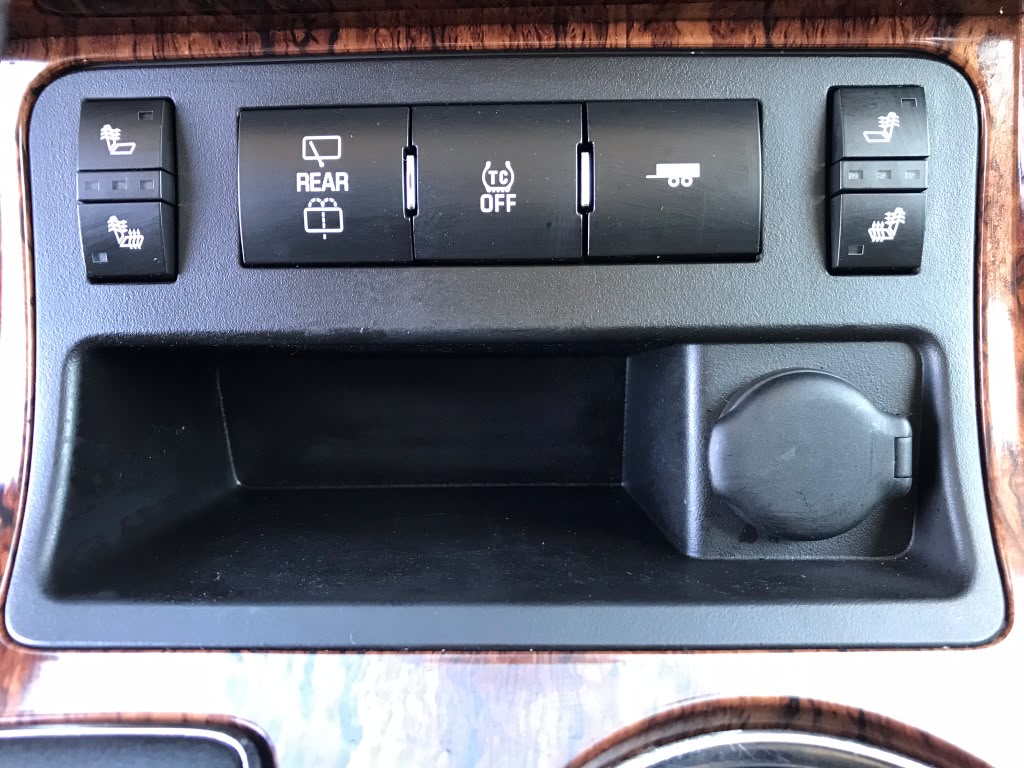 Vehicle dashboard console buttons and interior compartment deep steam cleaned by Miracle Detailing