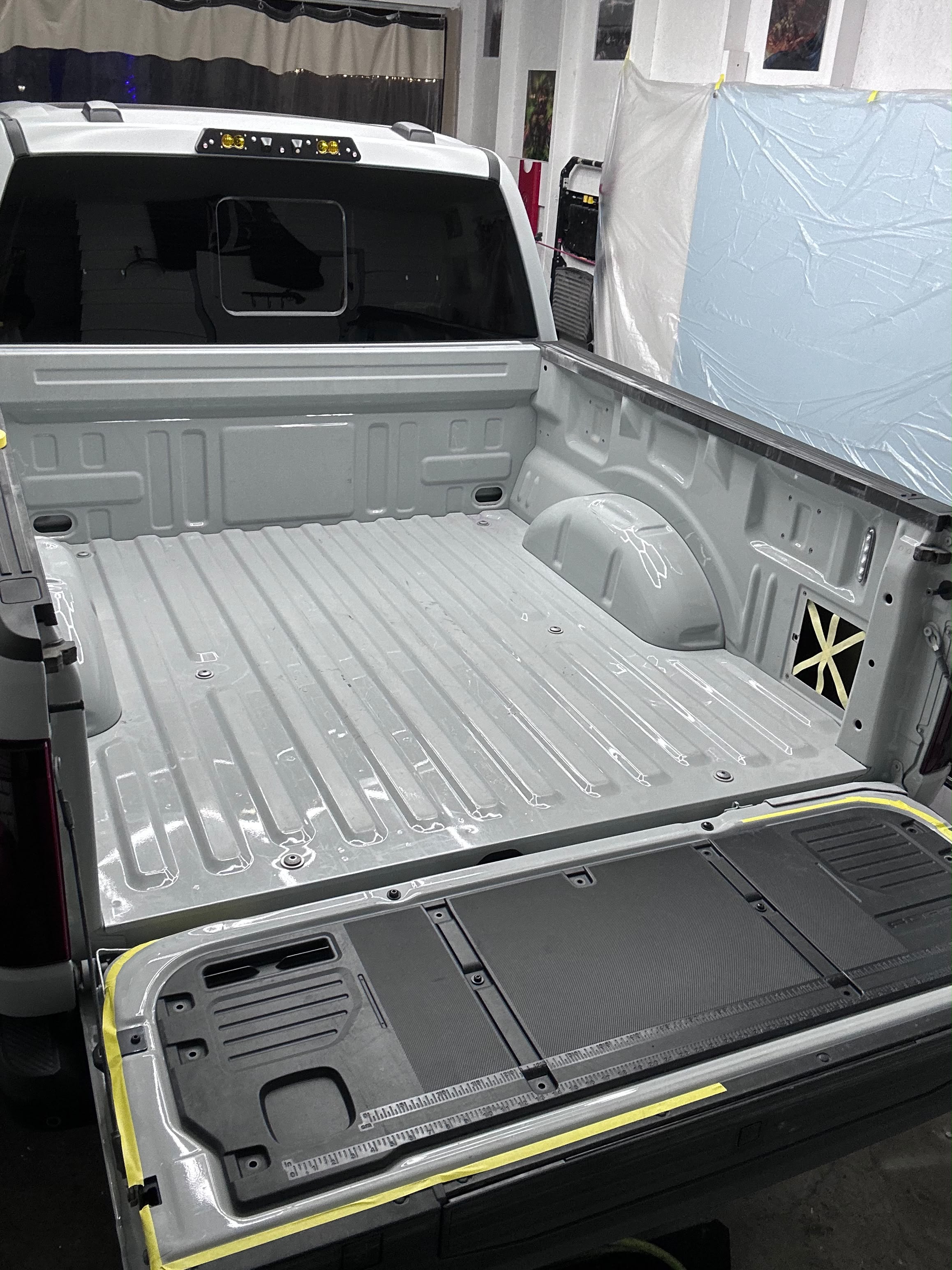 Ford F-150 truck bed fully scuffed and prepped in shop bay before spray-in bed liner coating by Miracle Detailing in Lindon UT