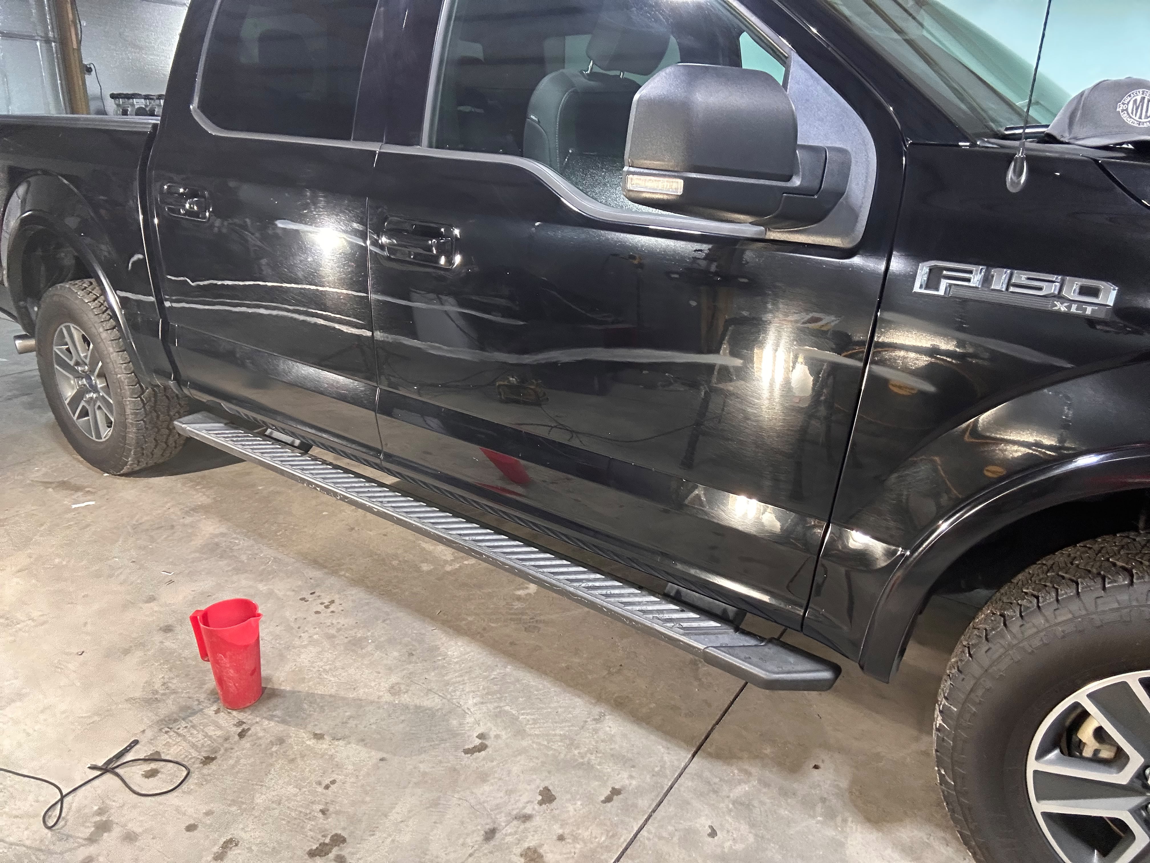 Black Ford F-150 XLT door panel deep scratch inspection and mapping before wet sanding scratch elimination by Miracle Detailing Lindon UT