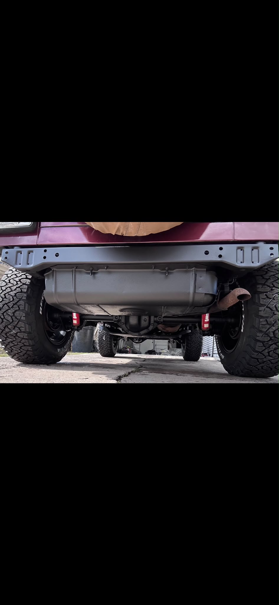 Jeep Wrangler undercarriage frame crossmember and fuel tank skid plate protected with black rust preventive coating by Miracle Detailing