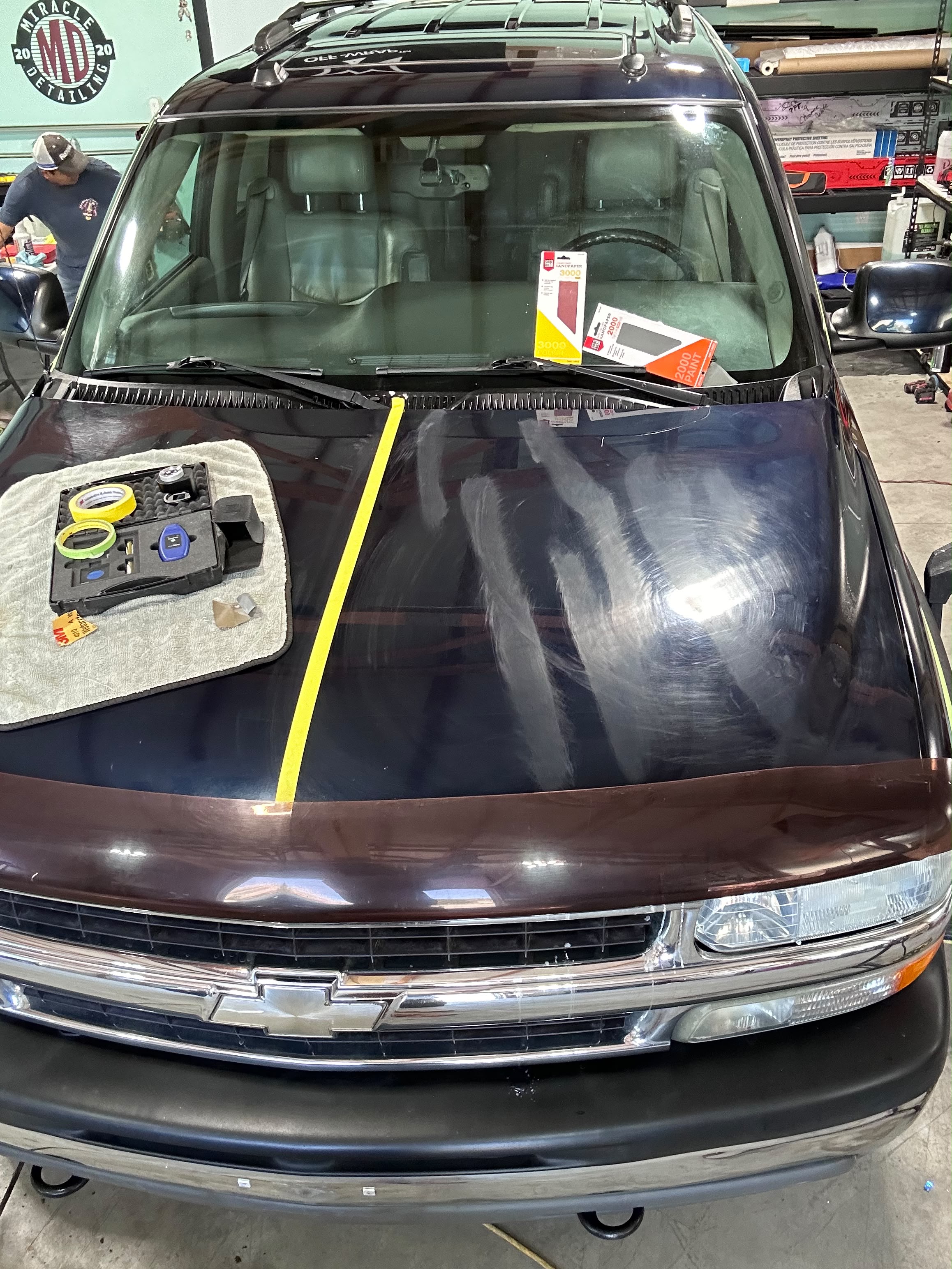 Chevy truck hood 50/50 wet sanding demo using 2000 and 3000 grit abrasive paper for scratch elimination by Miracle Detailing