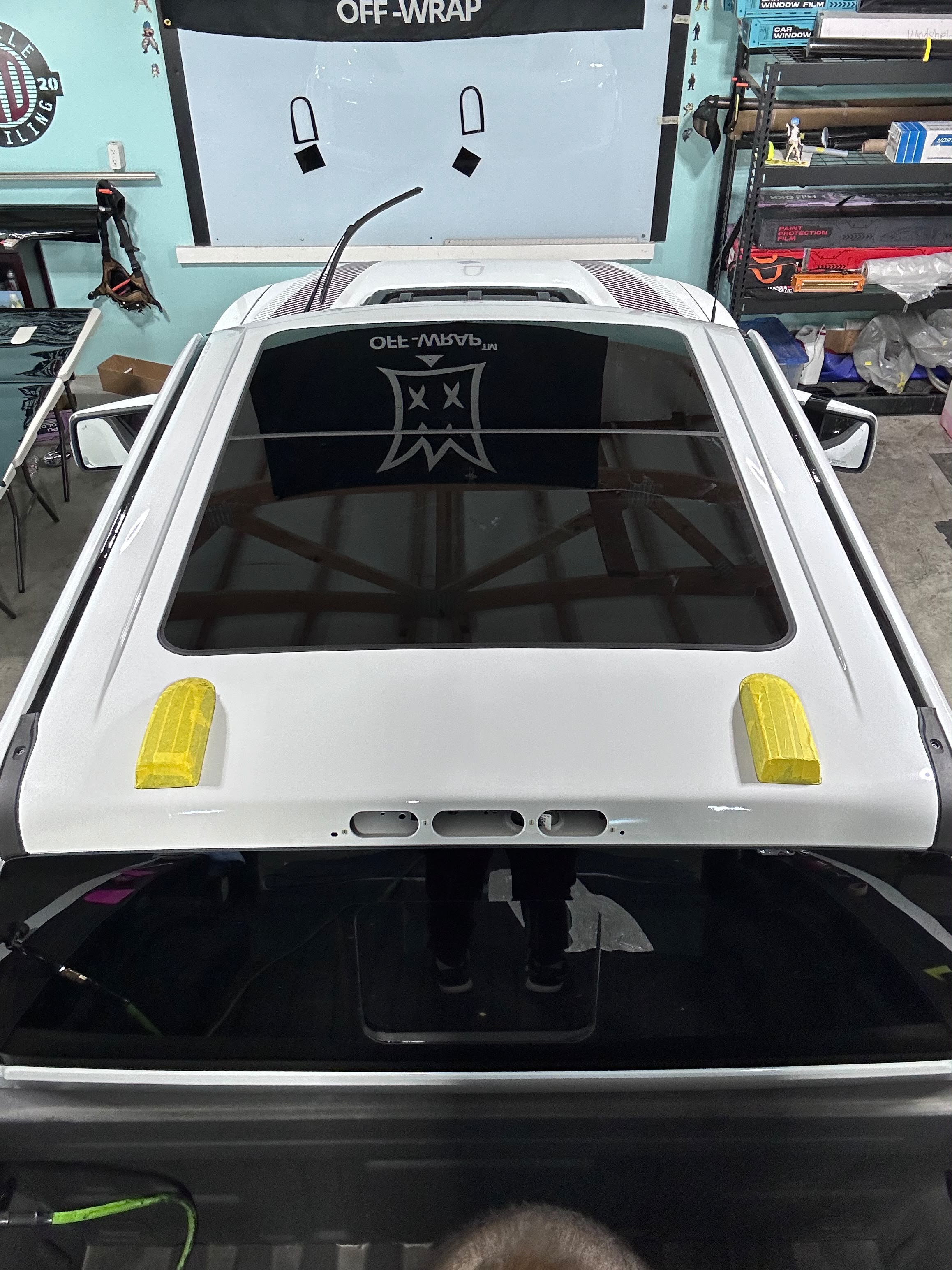 Truck cab roof prep and sunroof masking in shop bay before vinyl film application by Miracle Detailing Lindon UT