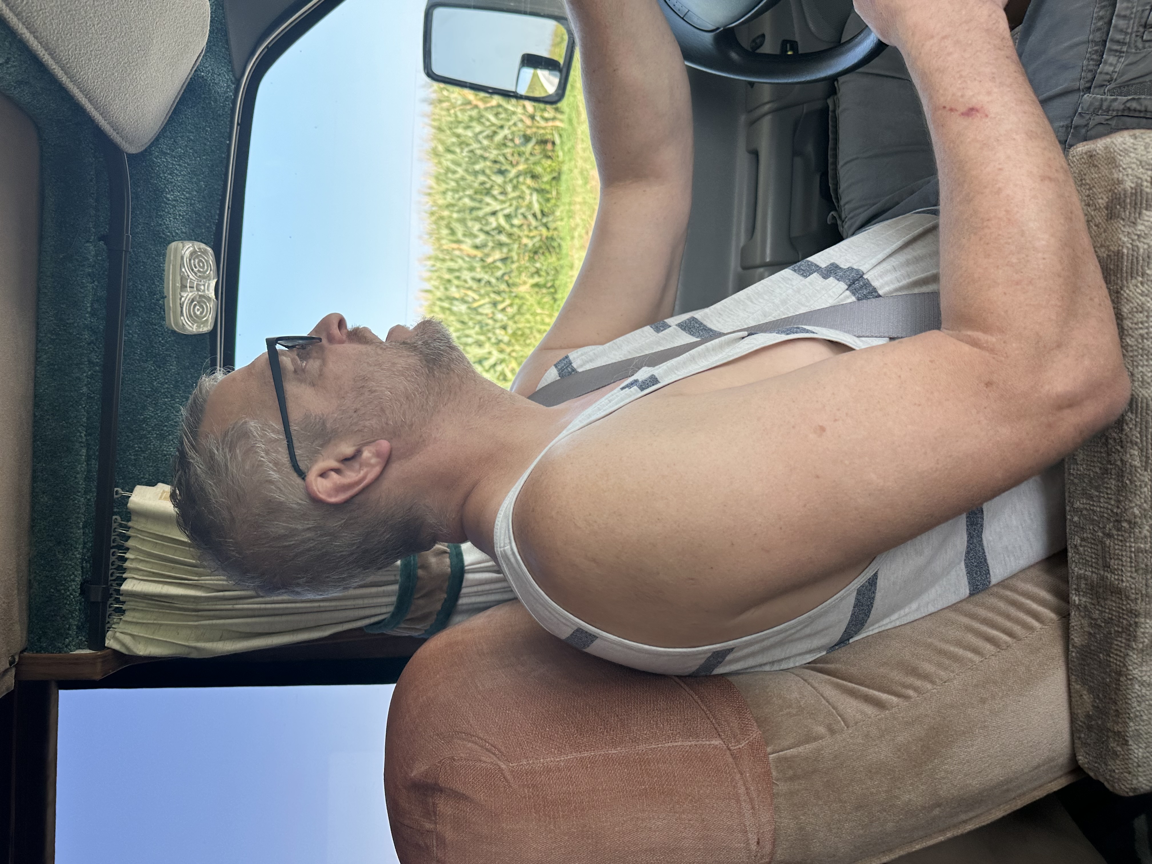 Phil behind the wheel driving Dazey on the open road