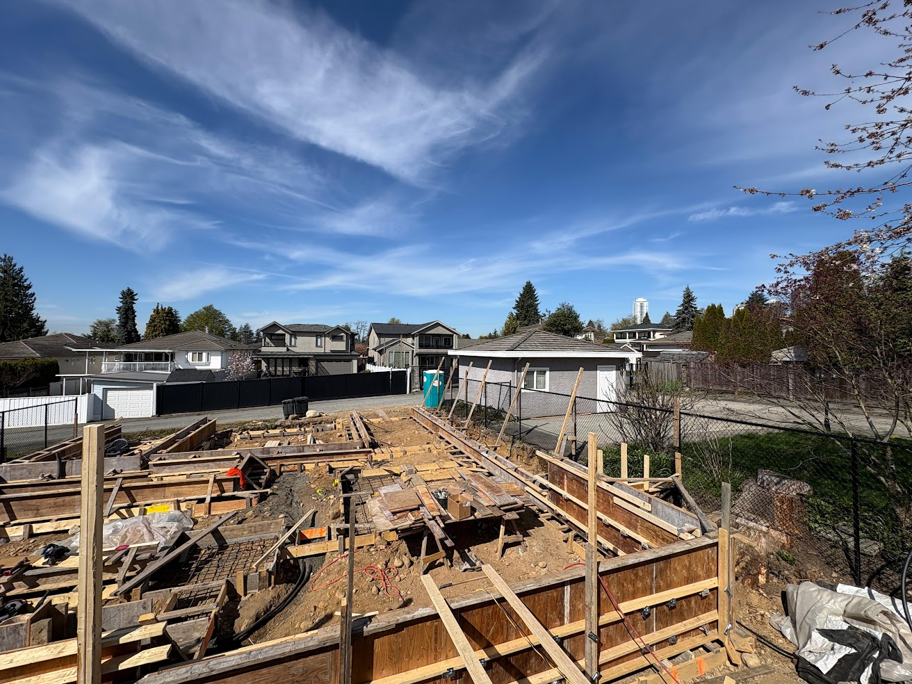 Extensive residential foundation formwork across a construction site