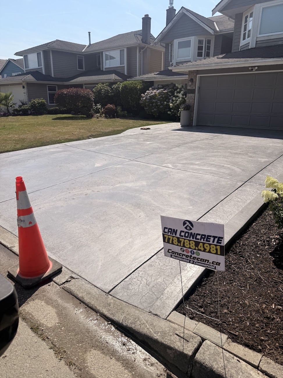 Finished interior concrete garage slab with clean surface and formed edge