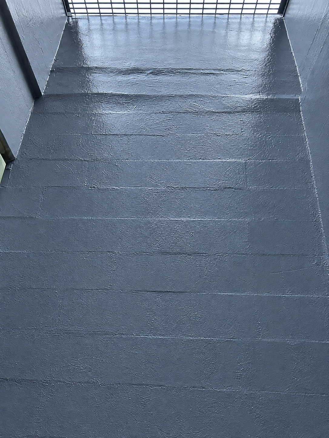 Close view of waterproofed concrete wall surfaces inside an air-shaft room