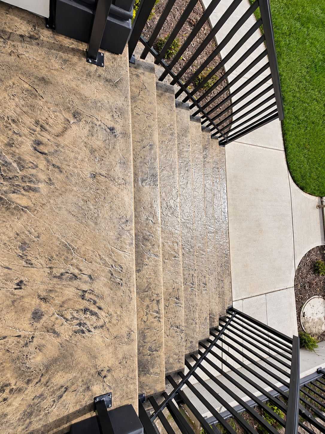 Fresh concrete stair run during construction with formed risers and treads.