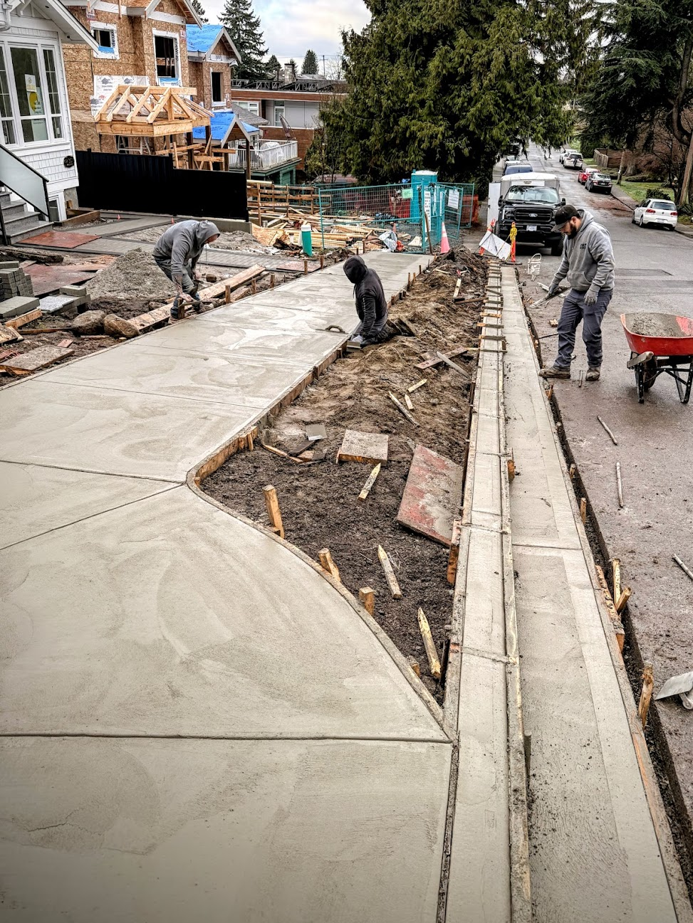 Can Concrete crew placing and finishing a sidewalk and curb section on a residential project.