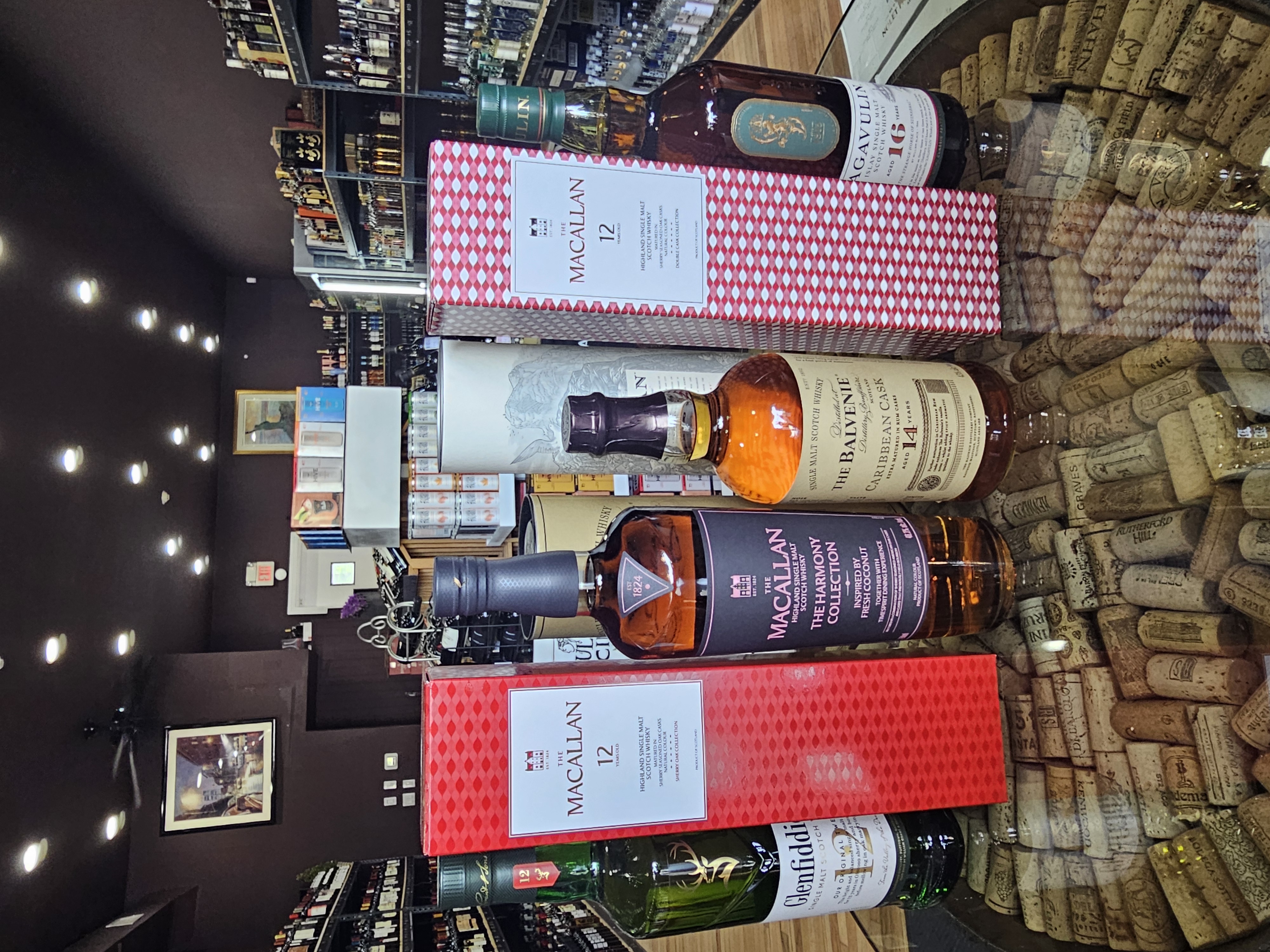 Premium single malt scotch whiskies including Macallan, The Balvenie, Lagavulin, and Glenfiddich displayed at Tuckahoe Wine and Spirits in Tuckahoe NY