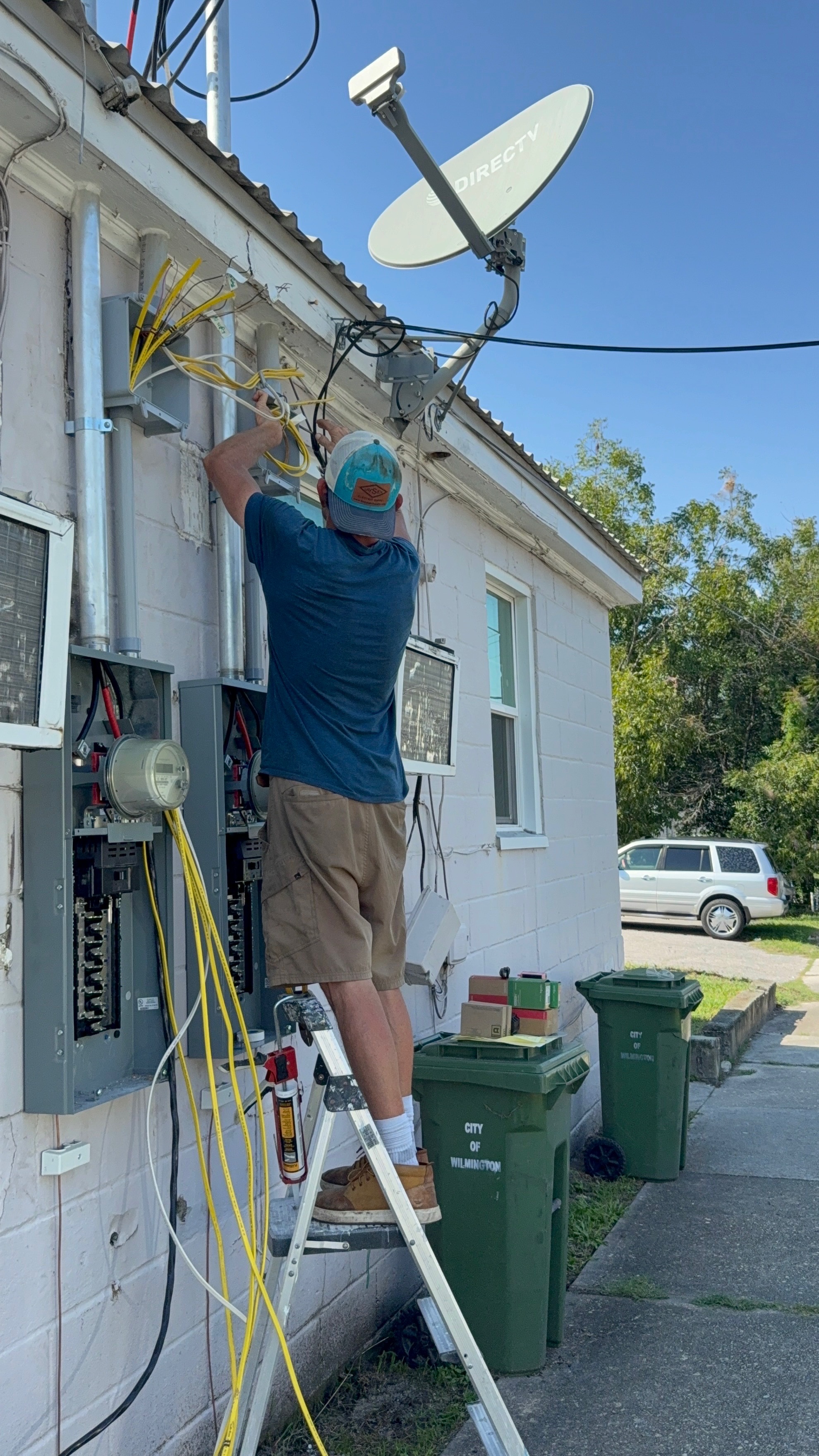Licensed electrician installing and servicing outdoor meter and electrical panels in Wilmington, NC
