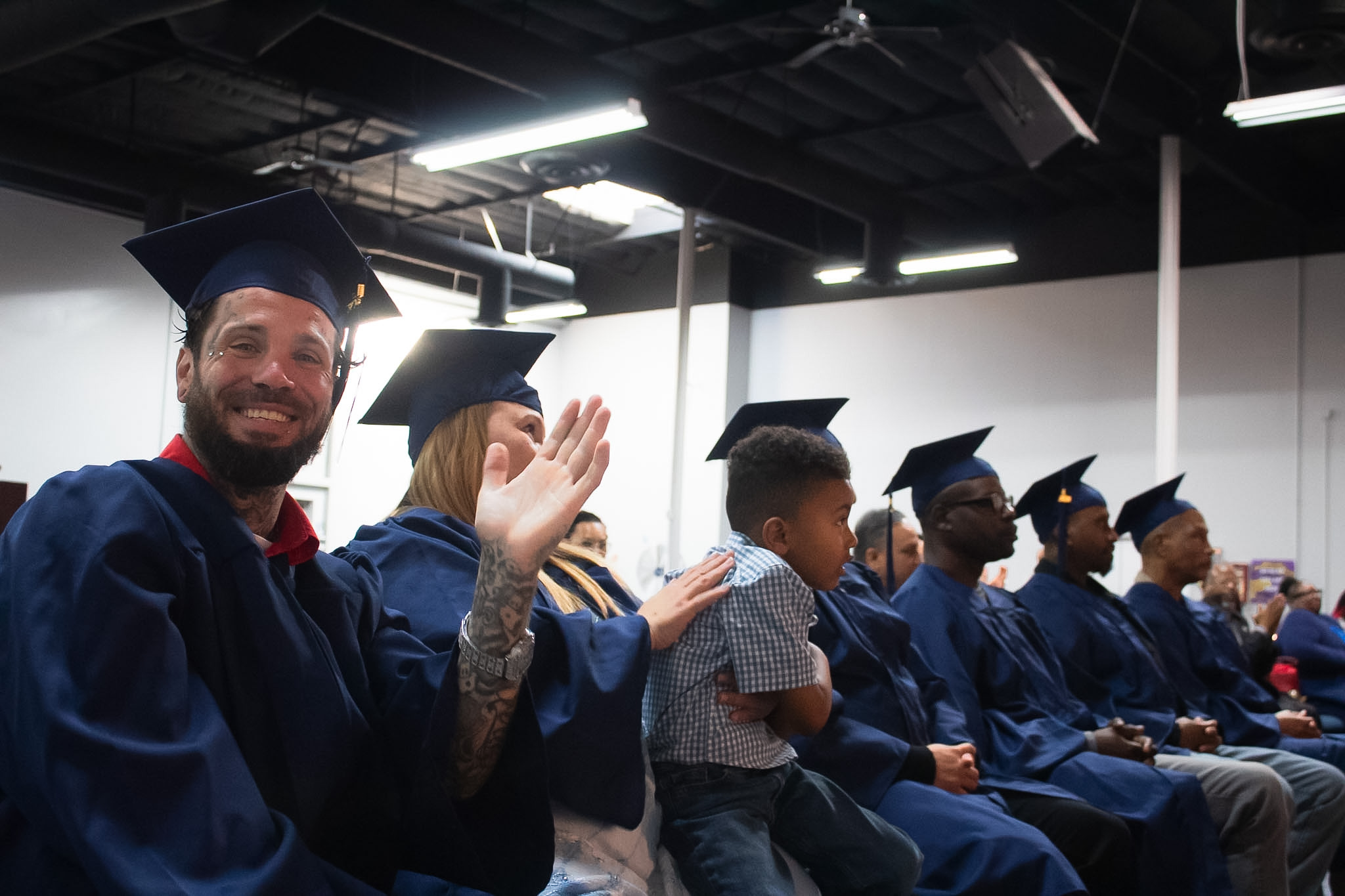 Mission Possible reentry graduation celebration with participants and families