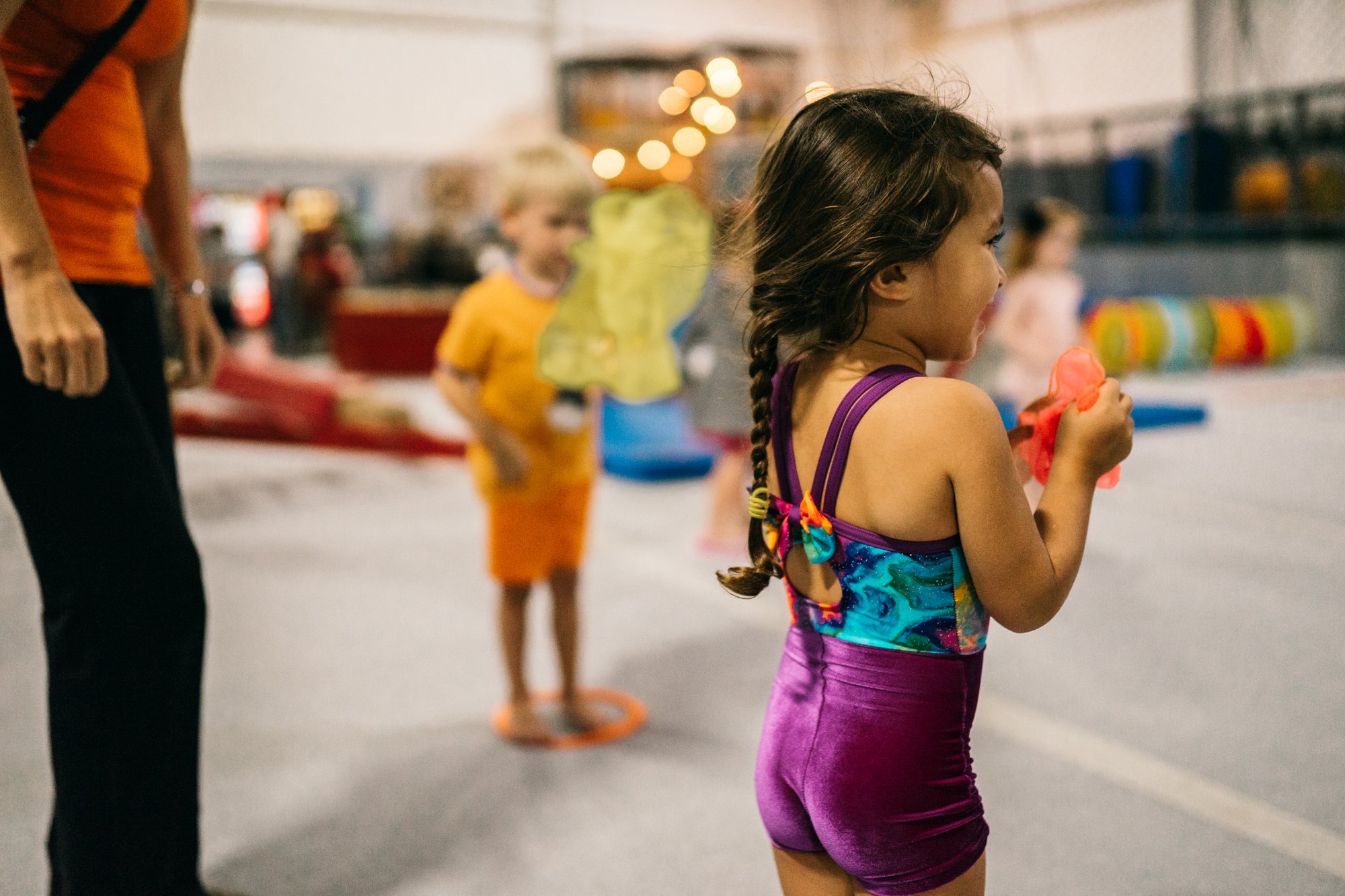 Young athlete raising their arms in celebration
