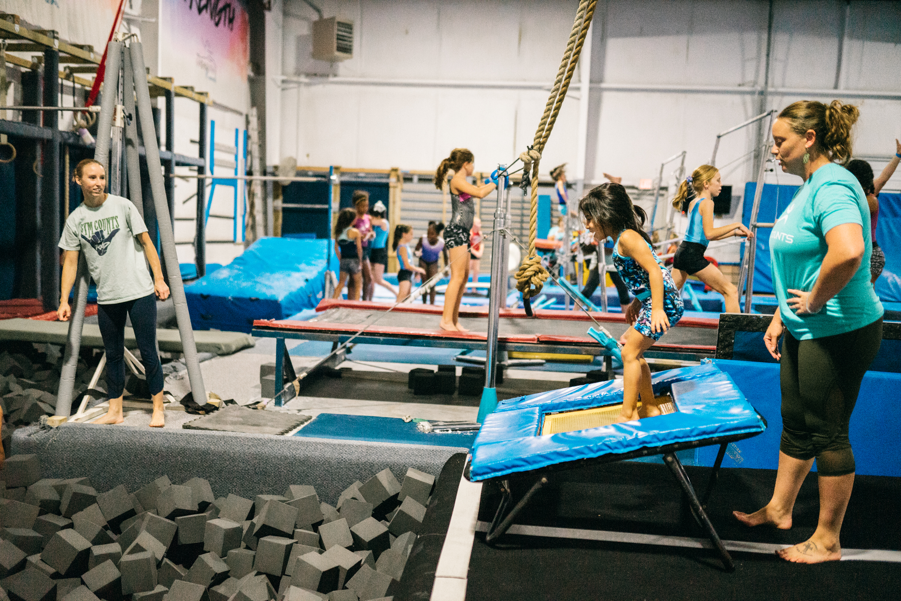 Athlete performing a floor tumbling skill at Gym Counts